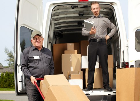Man and van loading furniture for a local removal in Addington