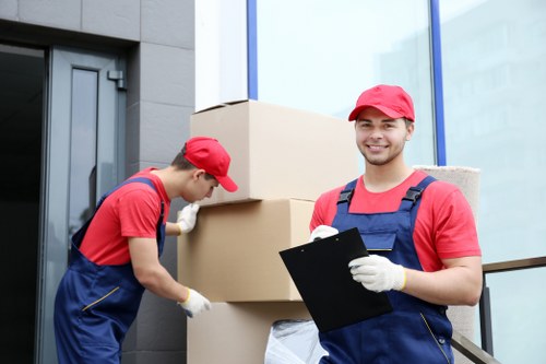 Man and van loading furniture for a local move in Addington