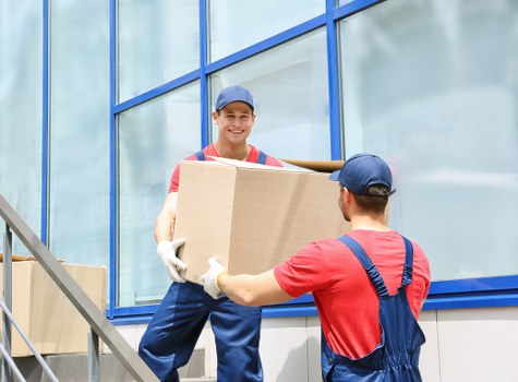 House removalists loading furniture for a home move in Addington