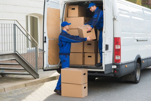 Removal team planning a local move in Addington with boxes and furniture