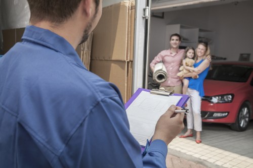 Mover assessing access points and hazards before carrying items through a property