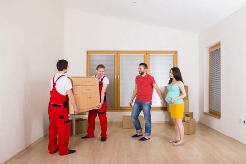 Moving van and packed boxes for a home move in Addington
