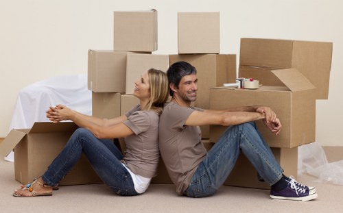 Preparing household items for a moving van in Addington