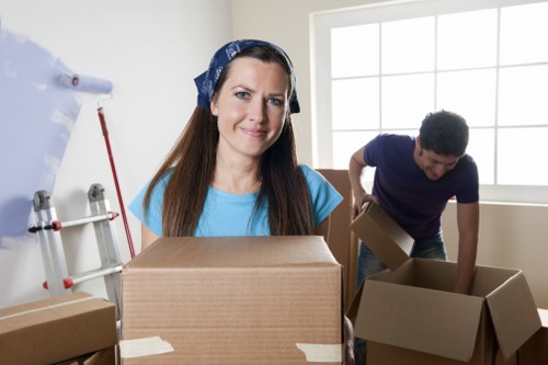 Moving day preparation with boxes and furniture protection for an Addington home