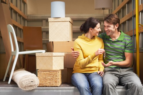 Loading furniture into a van for a house move in Addington